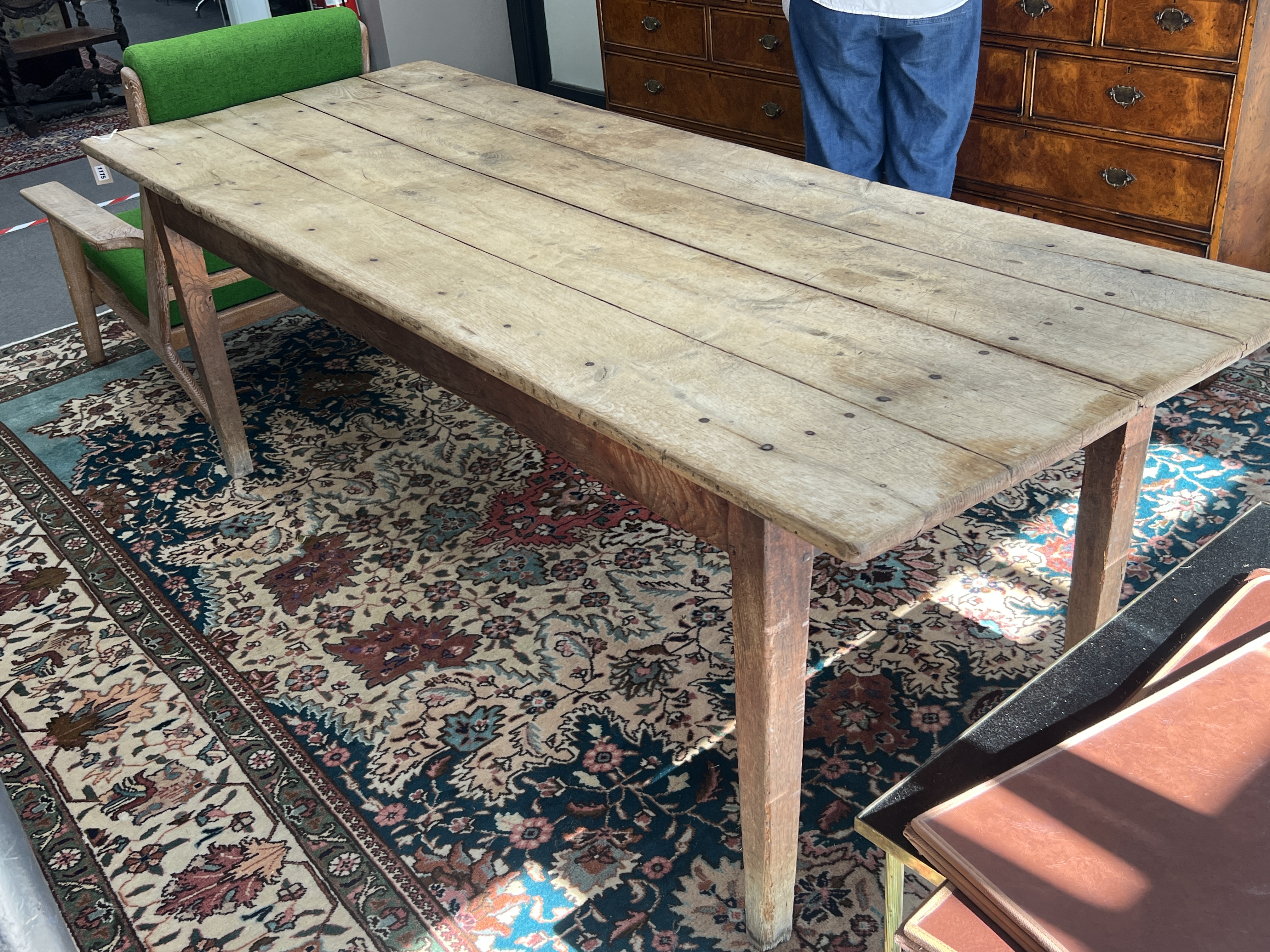 A 19th century French oak farmhouse table, width 220cm, depth 85cm, height 77cm